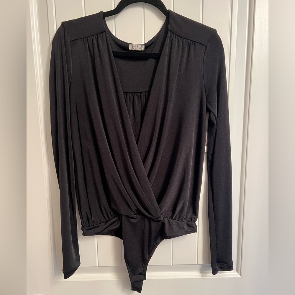 New with tags. Free People Turnt body suit